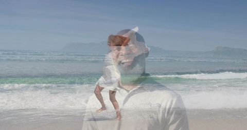 Smiling man on sunlit beach with dancing woman overlay, double exposure joy and freedom