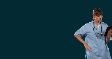 Thoughtful Female Doctor Using Digital Tablet