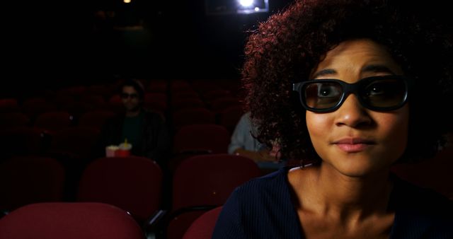 Woman Anticipating Movie Wearing 3D Glasses in Theatre - Download Free Stock Images Pikwizard.com