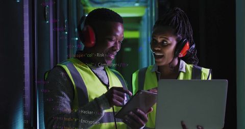 Inventive it engineers analyzing data in modern server room environment