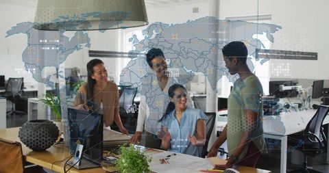 Diverse business team analyzing global data in modern office