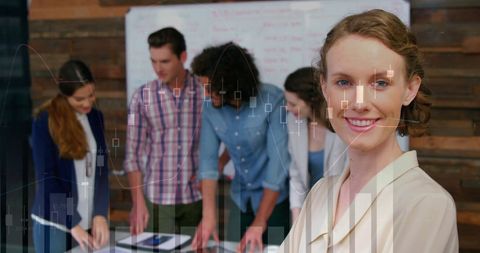 Successful Business Team Analyzing Financial Graphs in Office