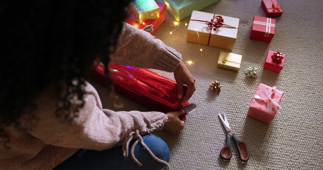 Woman Wrapping Festive Gifts for Christmas Celebration - Download Free Stock Images Pikwizard.com