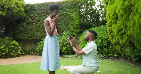 Romantic proposal in lush garden setting