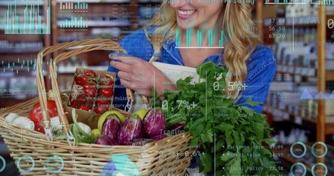 Smiling shopper selecting eggplants in wicker basket with fresh produce and data overlay