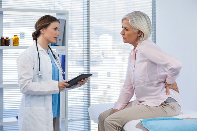 Patient consulting a doctor in clinic