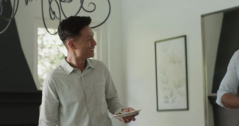 Guests enjoying conversation at elegant indoor wedding reception