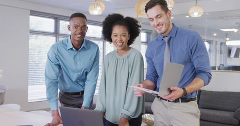 Diverse Business Team Smiling in Modern Office - Download Free Stock Images Pikwizard.com