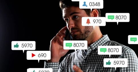 Man talking on phone managing social media notifications, messages and engagement overload