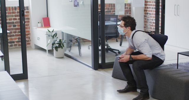 Man Wearing Face Mask Waiting in Office Reception Area - Download Free Stock Images Pikwizard.com