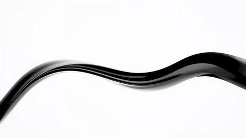 Flowing glossy black wave design on clean background