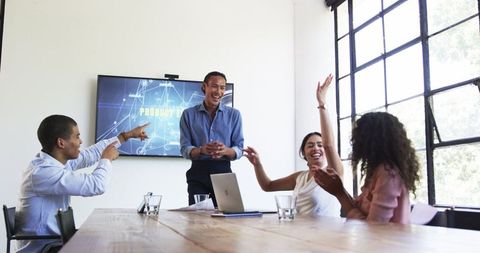 Diverse Office Team Celebrating Successful Business Meeting