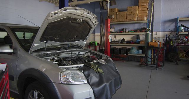 Image of car with open hood in car repair shop - Download Free Stock Photos Pikwizard.com