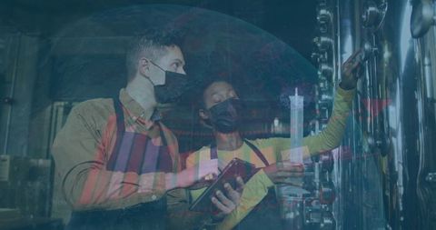 Brewery Technicians Evaluating Tank Valve Operations with Tablet