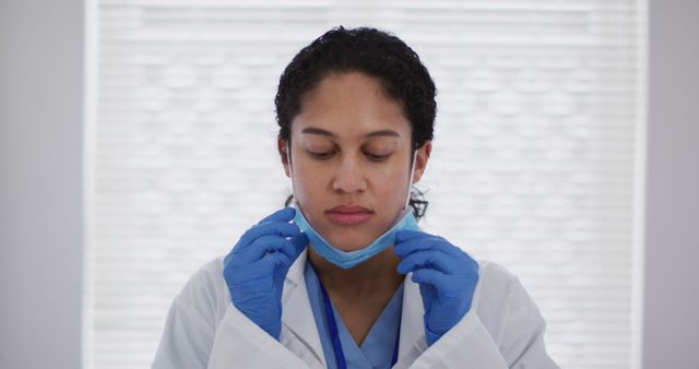 Female Doctor Removing Face Mask After Work - Download Free Stock Images Pikwizard.com