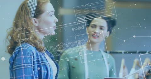 Diverse Women Collaborating with Digital Data Overlay in Office
