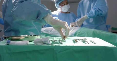 Surgeon Preparing for Surgery in Sterile Operating Room