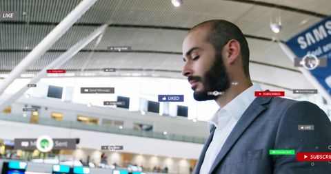 Businessman navigating social media notifications at airport