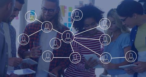 Diverse Team Collaboration and Networking in Modern Office Setting