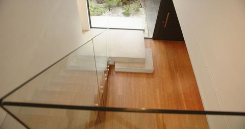 Elegant Minimalist Interior with Concrete Stairs and Courtyard View