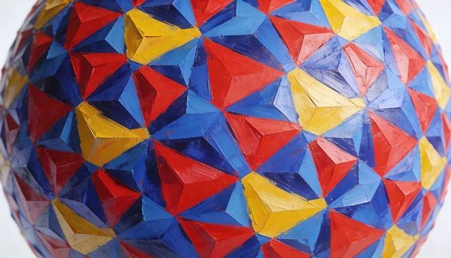 Hand-painted geometric sphere with vibrant tessellated facets and visible brushstrokes