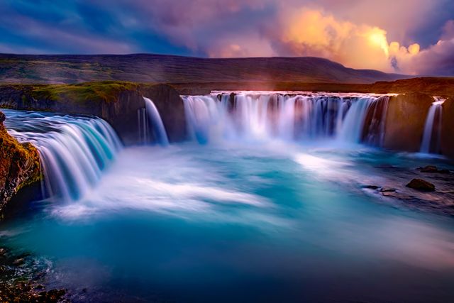Breathtaking Golden Hour at Goðafoss Waterfall in Iceland - Download Free Stock Photos Pikwizard.com