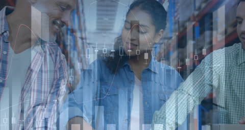 Diverse Warehouse Team Analyzing Financial Growth with Charts