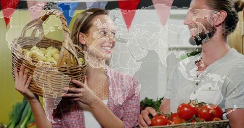 Smiling Market Vendors Holding Potato Basket and Tomatoes with World Map Overlay