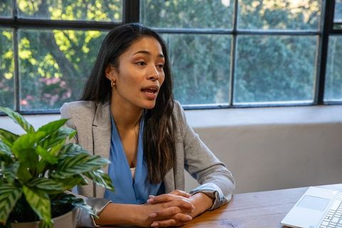 Professional woman speaking in modern office environment