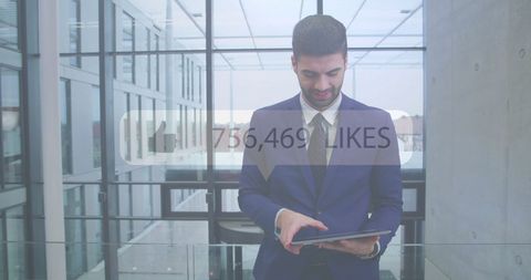 Businessman Checking Social Media on Digital Tablet