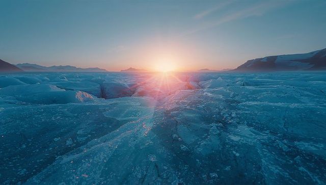 Spectacular Sunrise Over Arctic Ice Field with Dramatic Shadows