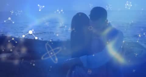 Couple Dancing on Shore with Futuristic Molecular Design Overlays