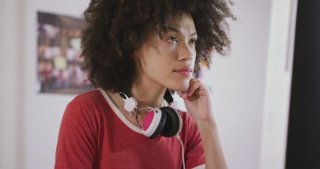 Thoughtful Young Woman with Headphones Looking Inspired - Download Free Stock Images Pikwizard.com