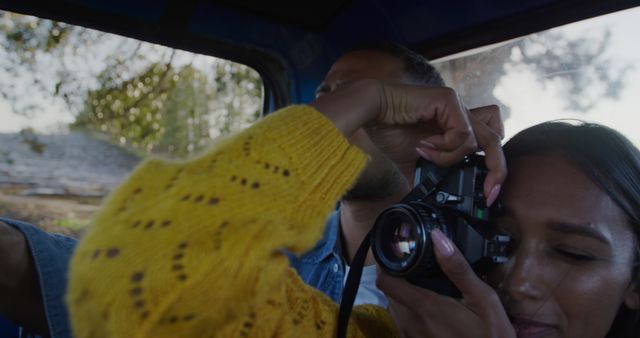 Young Woman Taking Photo from Car Window During Road Trip - Download Free Stock Images Pikwizard.com