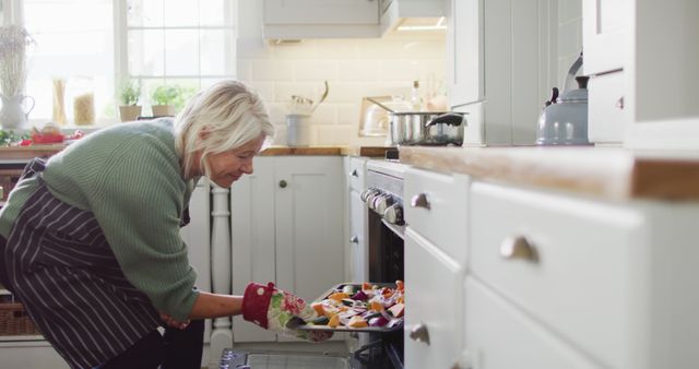 Senior Woman Baking Fresh Vegetables at Home in Kitchen - Download Free Stock Images Pikwizard.com