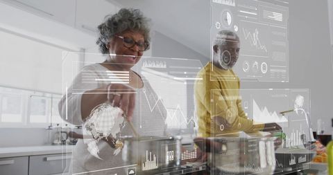 Senior Couple Cooking with Futuristic Digital Interfaces - Download Free Stock Images Pikwizard.com