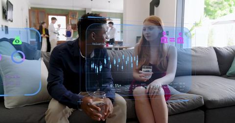 Young adults discussing financial data with futuristic hud overlay on living room couch