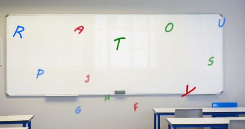 Alphabet Letters Floating Against Classroom Whiteboard - Download Free Stock Images Pikwizard.com