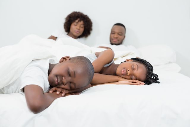 Parents and kids sleeping in bedroom - Download Free Stock Photos Pikwizard.com