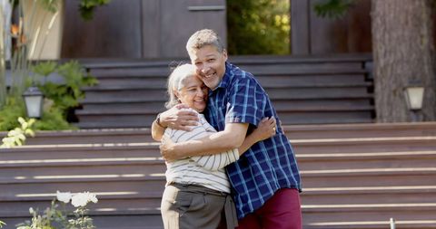 Happy Senior Couple Embracing in Sunlit Garden - Download Free Stock Images Pikwizard.com