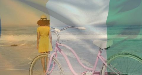 Woman in yellow dress gazing at ocean with pink bicycle and faded flag overlay