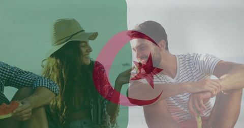Friends sharing watermelon on sunlit beach with algerian flag overlay boho summer vibe