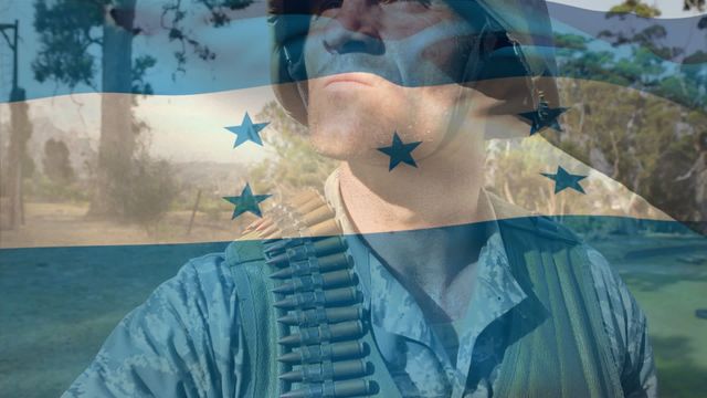 Biracial male soldier in military uniform with visible ammunition belt, juxtaposed with translucent Honduran flag. This strong display of patriotism and national identity can be used in materials promoting military appreciation, national holidays, or campaigns focused on national defense and public service. Ideal for editorial use or in content related to army recruitment.