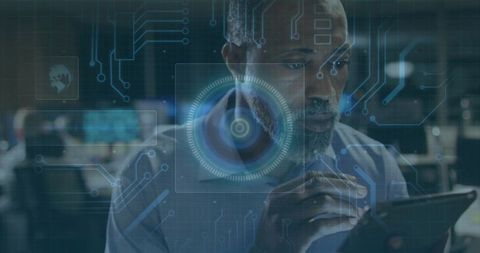 African american it specialist using tablet with futuristic hud interface in control room
