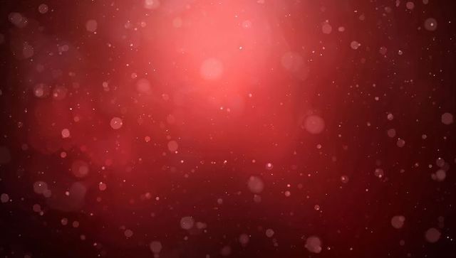 Crimson bokeh background with glowing central halo, floating particles and soft vignette