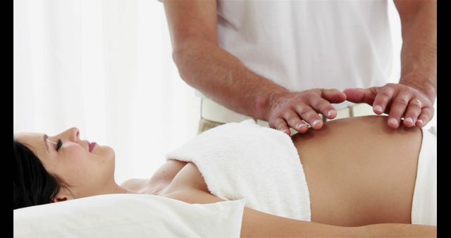 Pregnant Woman Receiving Prenatal Massage from a Professional Therapist - Download Free Stock Images Pikwizard.com