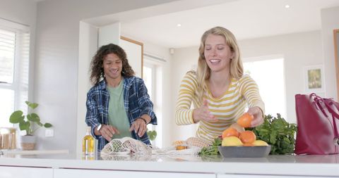 Happy Couple Unpacking Organic Groceries in Modern Kitchen - Download Free Stock Images Pikwizard.com