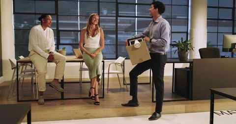 Diverse Team Collaborating in Modern Office During Evening