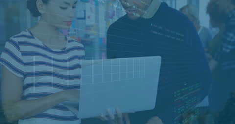 Business Colleagues Analyzing Financial Data on Laptop