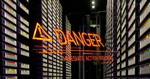 Warning alert in data center with digital overlay